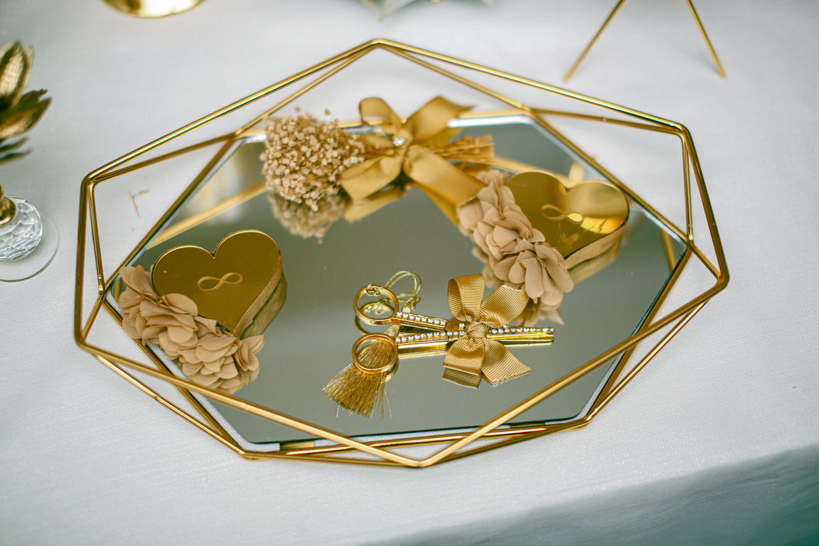 Gold tray with gold hearts and gold jewelry